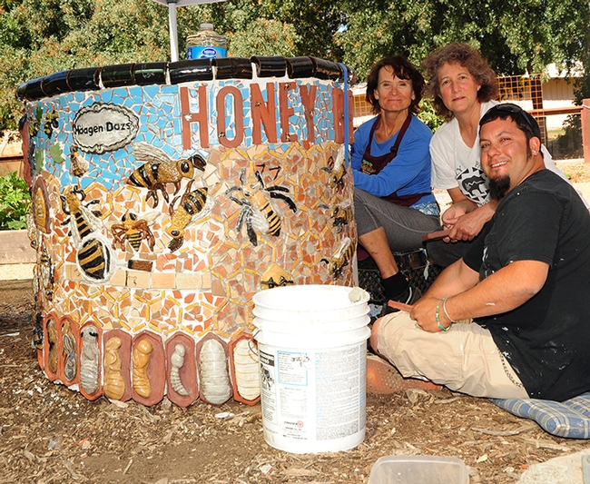 Artists installing the 2013 projects in the Häagen-Dazs Honey Bee Haven on Bee Biology Road pause for a photo. From left are Donna Billick, Diane Ullman and Mark Rivera. (Photo by Kathy Keatley Garvey)
