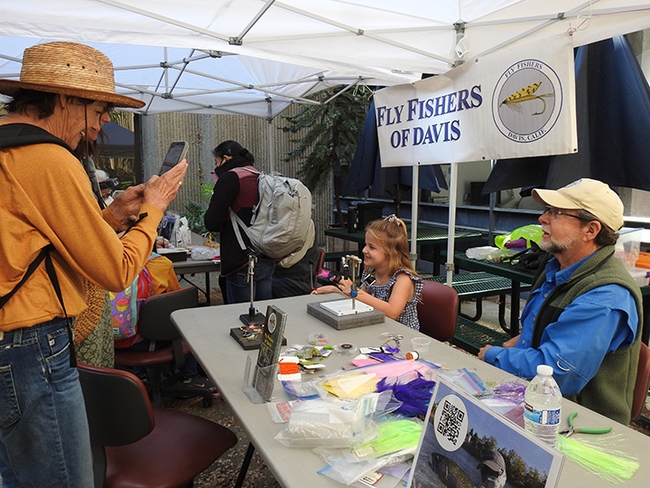 Making memories--family members  of Ella Eich take her picture with Paul Berliner of Fly Fishers of Davis. (Photo by Kathy Keatley Garvey)
