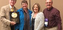 Eric Mussen (far left) received the prestigious Founders' Award from the Foundation for the Preservation of Honey Bees at the 75th annual American Beekeeping Federation conference in Reno in 2018. With him are his wife, Helen, and close friends Christine and Gene Brandi of Los Banos. Gene, the 2018 president of the American Beekeeping Federation, presented him with the award. for Bug Squad Blog