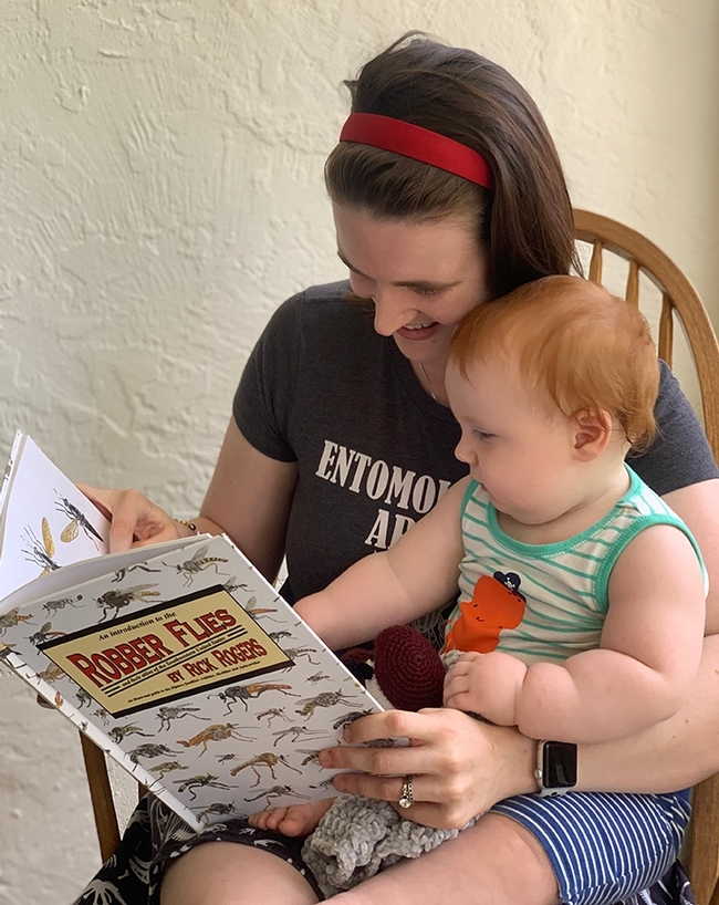 Young Griffin Albert learning about assassin (robber flies) from his mother in April 2021.