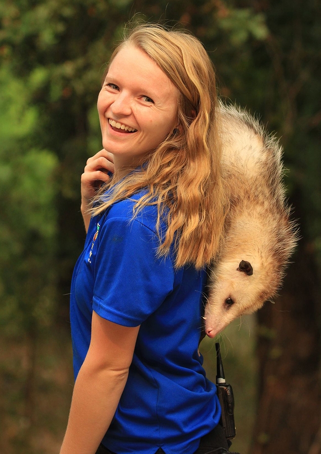 Former zookeeper Jonelle Mason, shown here with an opossum, is the coordinator of Project Learning Tree California.