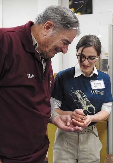 Bohart associate Greg Kareofelas checks out the diabolical ironclad beetle held by Bohart research associate Brittany Kohler. (Photo by Kathy Keatley Garvey)