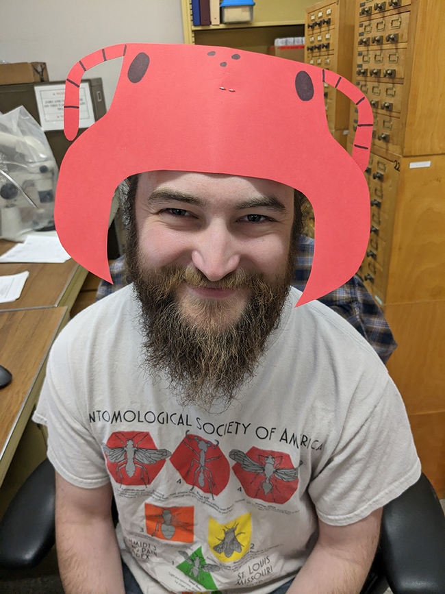 Brennen Dyer, Bohart Museum collections manager, models ant gear. Bohart Museum visitors can create their own ant headgear May 21.