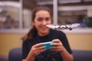 Fiona (teen leader) flying a drone
