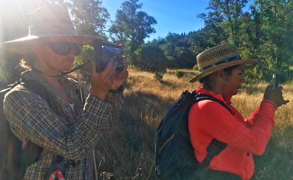 Undergraduate interns Erik Daniels (left) and Ariel Dasher (right) navigating through the backcountry of the Eel River watershed. Photo by Emily Cooper.