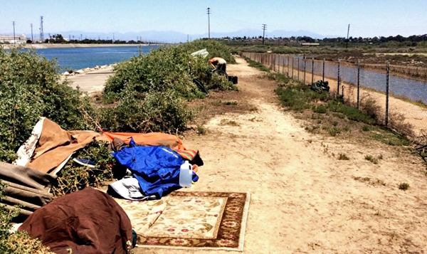 Homeless encampment along the Santa Ana River Trail near Newport Beach. Photo by ltenney1225 at Flickr under a Creative Commons license.
