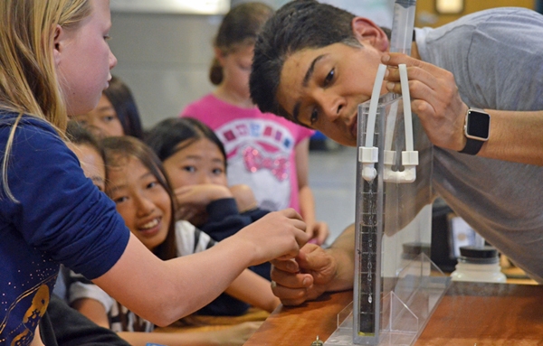 Youth have a chance to interact with the groundwater model. Photo by Marianne Bird.