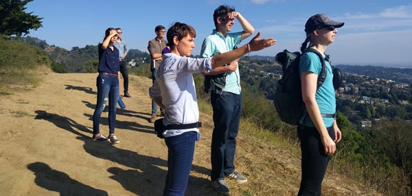 Nell Green Nylen (right) and her colleagues stop for a view of San Francisco Bay on a hike in the East Bay Hills above the UC Berkeley campus. Photo by Lidia Cano Pecharromán.