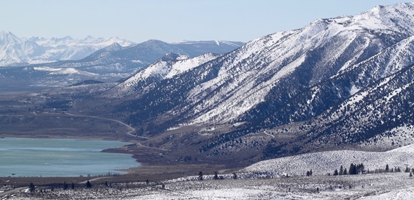 Snowy mountains surrounding Mono Lake. In 1941, the City of Los Angeles (350 miles away) began diverting water from four creeks that feed into the lake, creating challenges for local ecosystems and residents. Photo by David Zinniker.