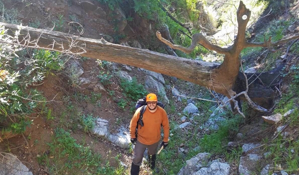 Graduate student Nathan Jumps revisiting Englewild Canyon to collect additional sediment samples. Photo by A. Gray.