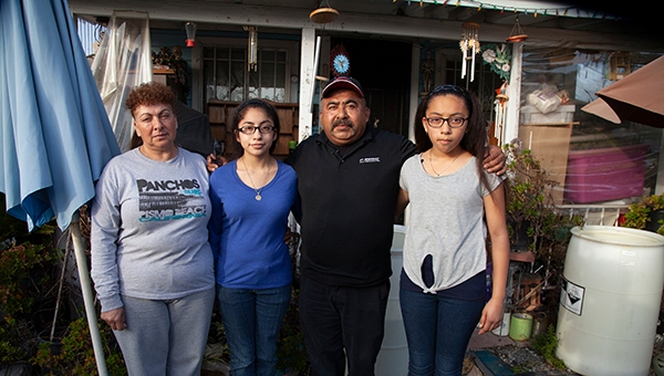 When Kristine Diekman spoke with the Garcia family, pictured in front of their home, they had been living without water in their well for almost two years. Photo by Kristine Diekman.