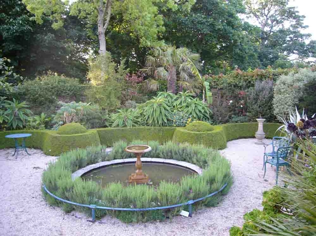 Lavender rings a bird bath in a formal 18th-century style garden in Cornwall, England. J. Lawrence