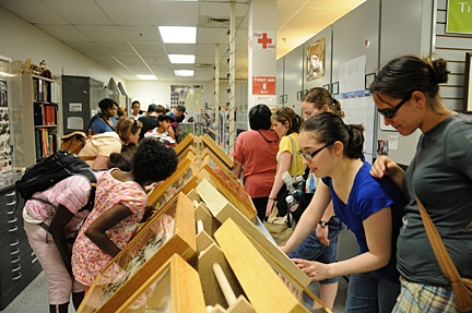 Visitors at Bohart Museum examine displays.