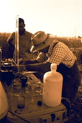 William Reisen working with water chemistry at a mosquito breeding site near Lahore, Pakistan.