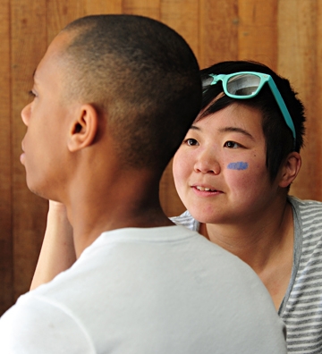Ivana Li works on a face-painting.