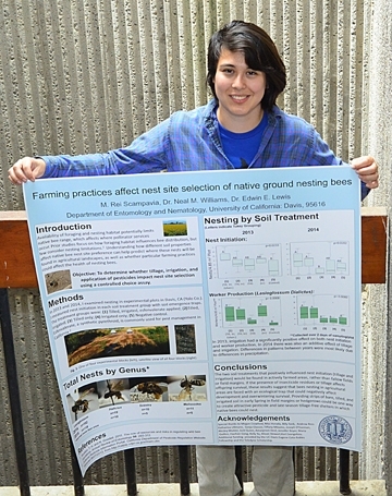 Rei Scampavia with her first-place research poster entered in the UC Davis Bee Symposium competition. (Photo by Kathy Keatley Garvey)