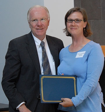Chancellor Larry Vanderhoef and Fran Keller with her outstanding graduate student teaching award.