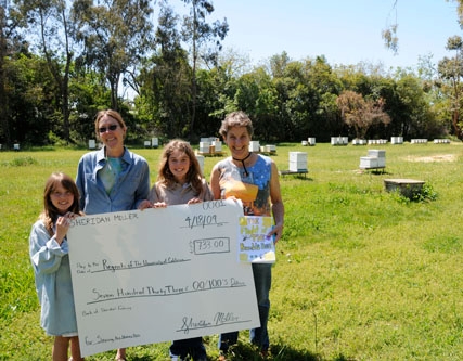 Sheridan Miller (second from right) presents a check to Lynn Kimsey (far right), professor and chair of the UC Davis Department of Entomology and director of the Bohart Museum of Entomology. From left are Annelie Miller, 8, Sheridan's sister who helped with the fundraising; bee breeder-geneticist Susan Cobey; Sheridan Miller, 11; and Lynn Kimsey.