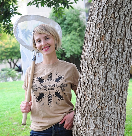 Stacey Rice wearing her winning t-shirt in the Entomology Entomology Graduate Students' Association's annual t-shirt design contest. It features stag beetles. (Photo by Kathy Keatley Garvey)