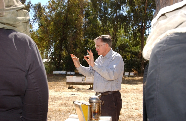 Eric Mussen discussing the health of honey bees at the Harry H. Laidlaw Jr. Honey Bee Research Facility. (Photo by Kathy Keatley Garvey)