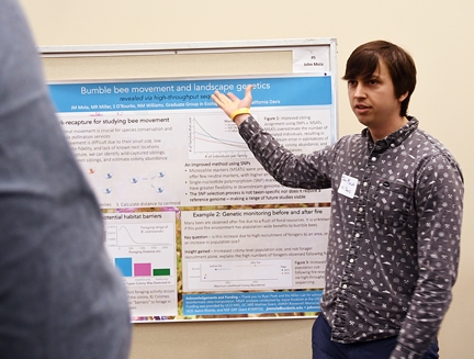 UC Davis doctoral student John Mola explains his research. He won the graduate student poster competition.