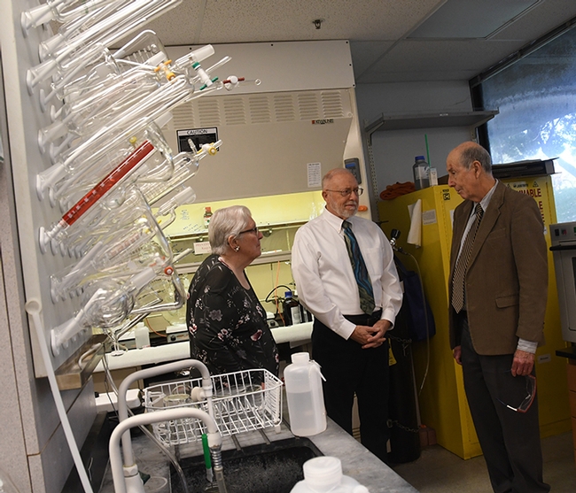 Western Neuropathy Association president Bev Anderson and treasurer Darrell O'Sullivan (center) chat with UC Davis distinguished professor Bruce Hammock about his work. Hammock  researches an enzyme aimed at controlling acute and neuropathic pain.  EicOsis, the Davis company that Hammock founded to move inhibitors of the soluble epoxide hydrolase into the human clinical trials. (Photo by Kathy Keatley Garvey)