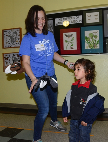 Graduate student Rebecca Godwin of the Jason Bond lab helps youngsters 