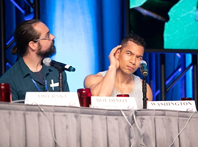 Some logistics issues complicated the first round of the Linnaean Games. Here UC Linnaean Games Team captain Ralph Washington Jr. (right) strains to hear. At left is Brendon Boudinot. (ESA Photo)
