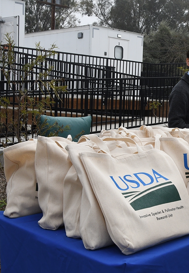 USDA tote bags awaiting the special guests. (Photo by Kathy Keatley Garvey)