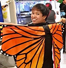 RJ Millena portrays a monarch at the Bohart Museum of Entomology's Halloween party.
