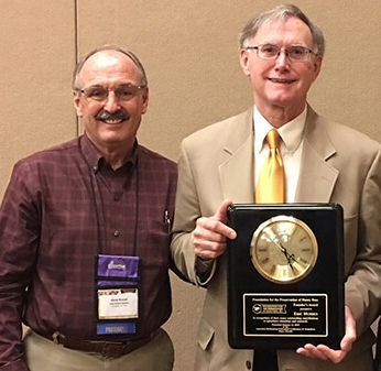 Gene Brandi, 2018 president of the American Beekeeping Federation, presents Eric Mussen with the Founders' Award from the Foundation for the Preservation of Honey Bees at the 75th annual American Beekeeping Federation conference. (Photo courtesy of Gene Brandi)
