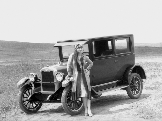 Fig. 4: This is Mary Foley and the Chevrolet coach she traveled in from Washington, D.C., across the continent.