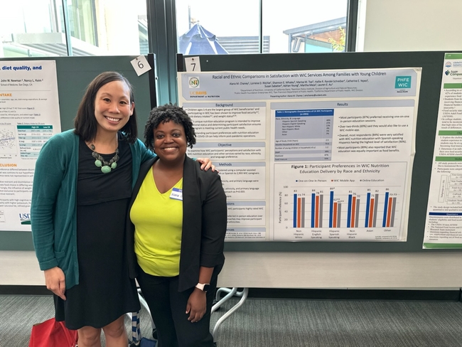 Doctoral student Alana Chaney (right) with NPI-affiliated researcher Lauren Au at a conference