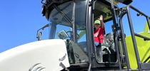 A Butte County youngster is all smiles as he gets an up-close look at a harvester during Ricetastic Day at Schohr Ranch. Photo by Mike Hsu for Food Blog Blog