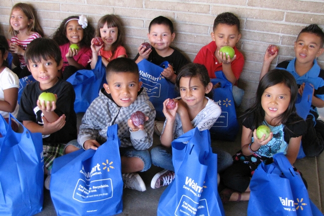 Kids enjoying fresh fruit at Roosevelt Elementary School.