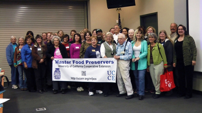 Participants line up for a group photo at the first-ever Master Food Preserver conference.