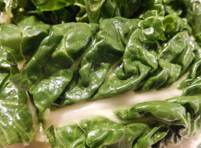 Chopped swiss chard leaves, with the stems removed, are a milder substitute for spinach.