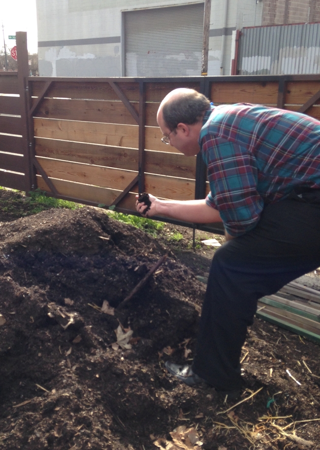 Rob Bennaton, UC Cooperative Extension advisor, helps urban farmers test soil in Alameda County.