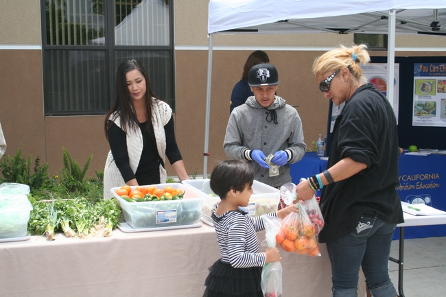 A mini farm stand in front of Vang Pao Elementary School in Fresno offers farm-fresh produce to children and families.