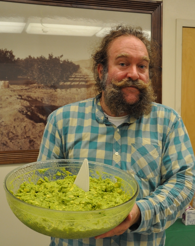Eric Focht shows the guacamole he prepares for an avocado tasting at UC Riverside.
