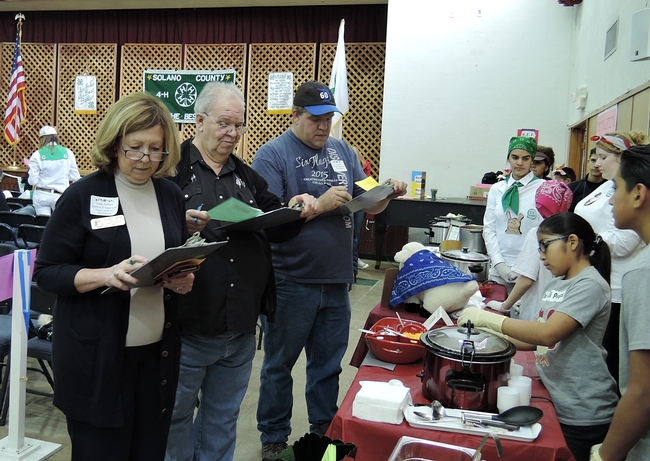 Judging the Solano County Chili-Cookoff are evauators (from left) Solano County Supervisor Linda Seifert of District 2 and James Luka and his son, Jim, of Vallejo. (Photo by Kathy Keatley Garvey)