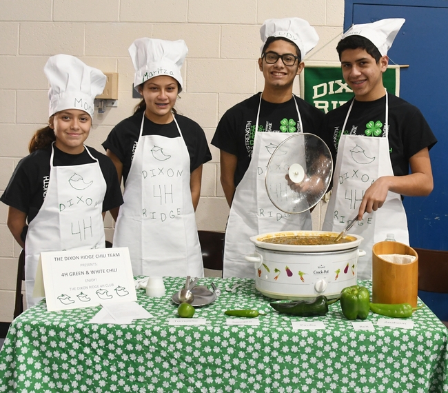 This is the championship Dixon Ridge 4-H Club Chili Team: (from left)  siblings Moncerral “Monce” Torres Cisneros, Maritzia Partida Cisneros, Rudolfo “Rudy” Radillio Cisneros, and Miguel Partida Cisneros. They made “4-H Green and White Chili.” (Photo by Kathy Keatley Garvey)