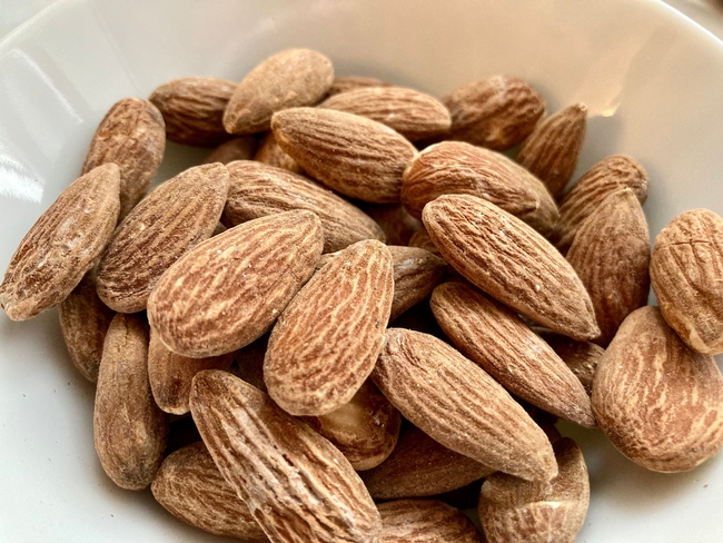 Dry roasted almonds in a bowl.