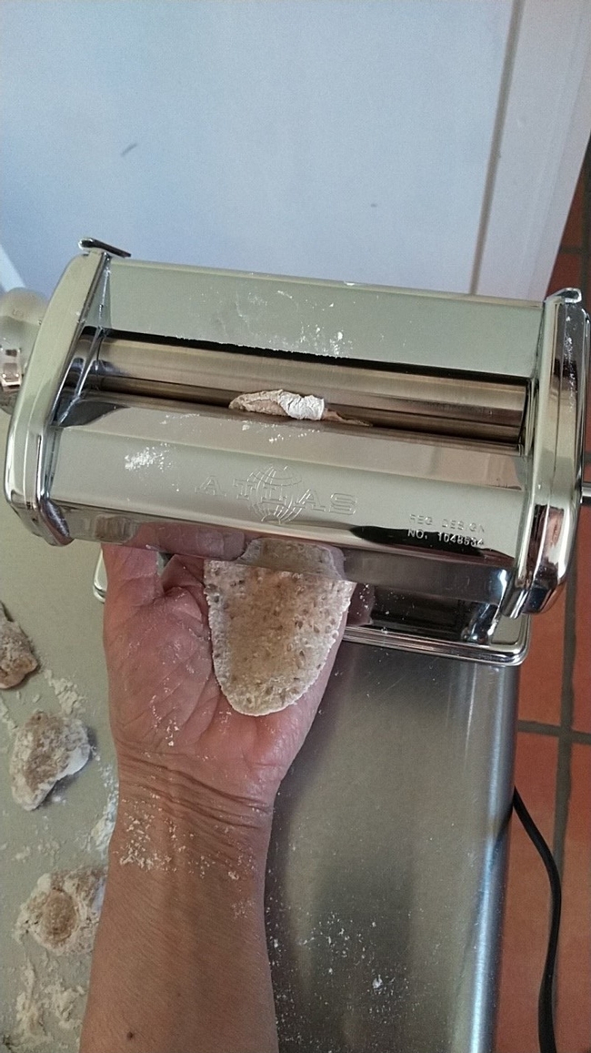 Dough piece running through pasta machine(1)