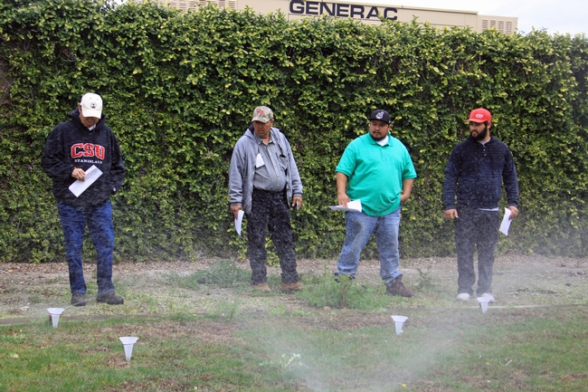 Green Gardener training participants conduct a sprinkler test.