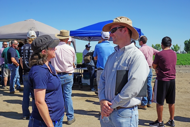 Lynn Sosnoskie, left, and David Doll talk at the drone field day.