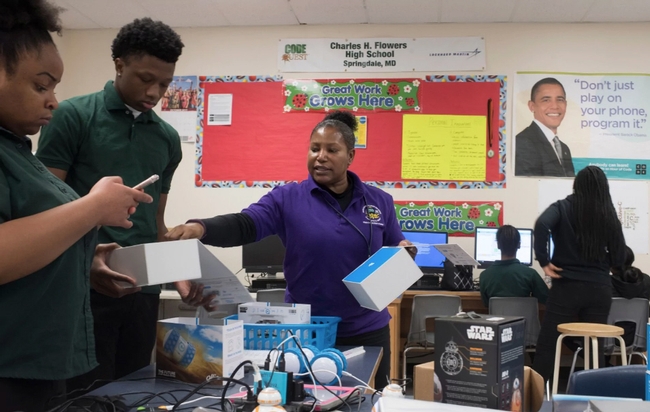 Teacher Marilyn Fitzpatrick gives guidance to 10th-graders Stephanie Okoro and Reginald Bryant in her AP Computer Science Principles course at Flowers High. (Marvin Joseph/The Washington Post)