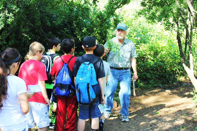 Students from the Browns Valley Elementary School learn about local flora and fauna from retired specialist, Dr. Doug McCreary.