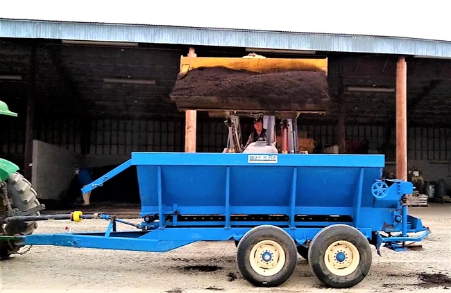 Loading compost into the compost spreader
