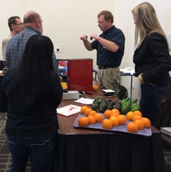 Participants visit interactive demonstrations by produce quality measurement companies.